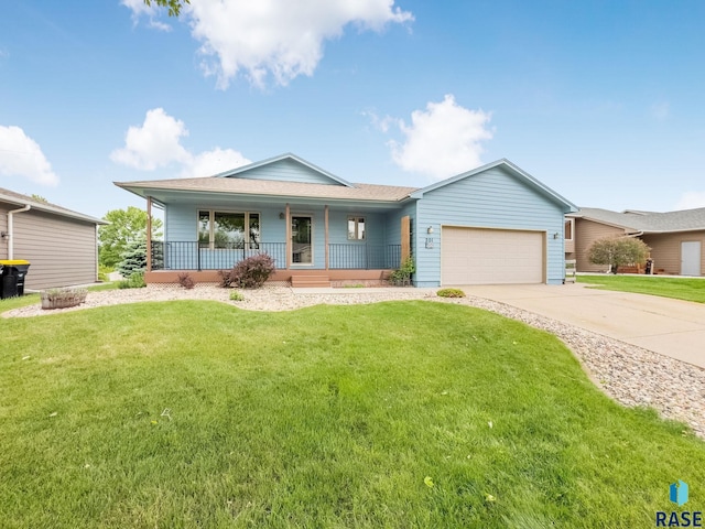 201 N Foss Ave, Sioux Falls, SD 57110 - ranch-style house featuring a porch, a garage, driveway, and a front yard