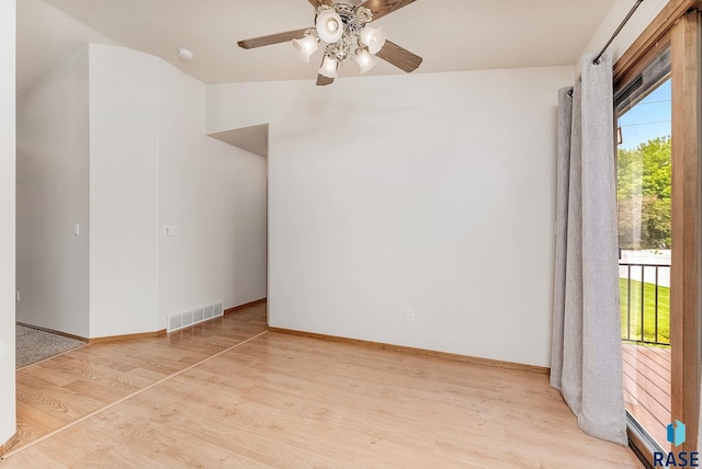 201 N Foss Ave, Sioux Falls, SD 57110 - spare room featuring plenty of natural light, ceiling fan, wood finished floors, and baseboards