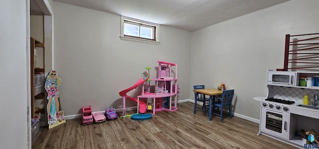 2904 S Glendale Ave, Sioux Falls, SD 57105 - recreation room with wood finished floors and baseboards