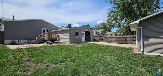 2904 S Glendale Ave, Sioux Falls, SD 57105 - view of yard featuring a patio, a deck, and driveway