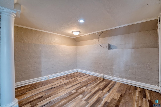 316 S Sherman Ave, Sioux Falls, SD 57103 - empty room featuring decorative columns, a textured wall, wood finished floors, baseboards, and ornamental molding