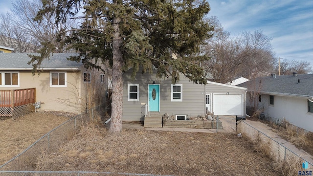 316 S Sherman Ave, Sioux Falls, SD 57103 - back of house featuring a garage, entry steps, and concrete driveway