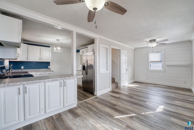 316 S Sherman Ave, Sioux Falls, SD 57103 - kitchen with stainless steel fridge with ice dispenser, a ceiling fan, ornamental molding, a textured ceiling, and white cabinetry