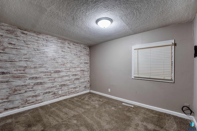 316 S Sherman Ave, Sioux Falls, SD 57103 - unfurnished room featuring a textured ceiling, carpet floors, and baseboards