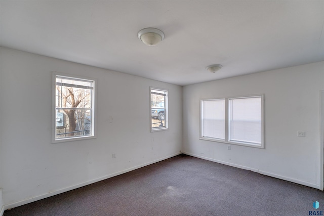 316 S Sherman Ave, Sioux Falls, SD 57103 - unfurnished room featuring dark colored carpet and baseboards