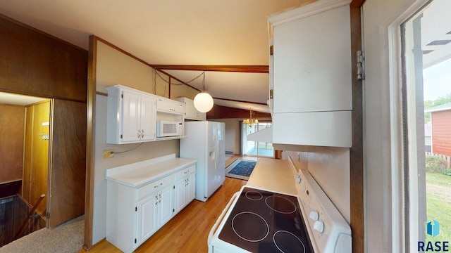 1024 Orchard Dr, Brookings, SD 57006 - kitchen featuring white appliances, light countertops, white cabinets, light wood-style floors, and plenty of natural light