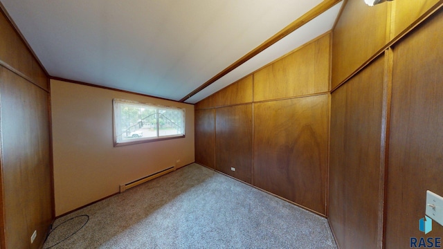 1024 Orchard Dr, Brookings, SD 57006 - empty room featuring baseboard heating, vaulted ceiling, and carpet flooring