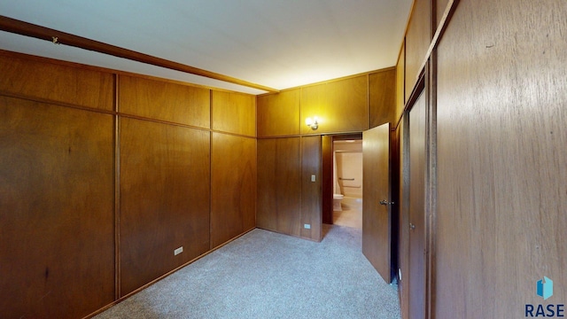 1024 Orchard Dr, Brookings, SD 57006 - corridor with light colored carpet and wood walls