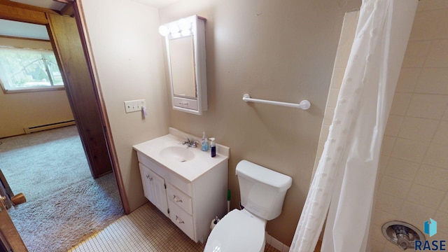 1024 Orchard Dr, Brookings, SD 57006 - full bath featuring baseboard heating, toilet, vanity, and a shower with shower curtain