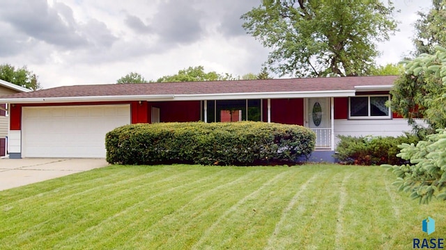 1024 Orchard Dr, Brookings, SD 57006 - single story home with a garage, concrete driveway, and a front lawn