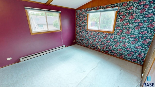 1024 Orchard Dr, Brookings, SD 57006 - carpeted empty room with a baseboard radiator, plenty of natural light, lofted ceiling, and wallpapered walls