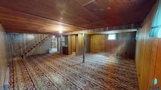 1024 Orchard Dr, Brookings, SD 57006 - basement featuring a baseboard radiator, wooden walls, wood ceiling, and stairs