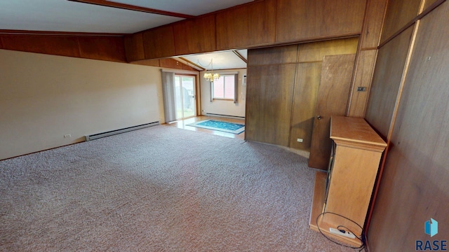 1024 Orchard Dr, Brookings, SD 57006 - unfurnished room featuring a baseboard radiator, a chandelier, and carpet floors