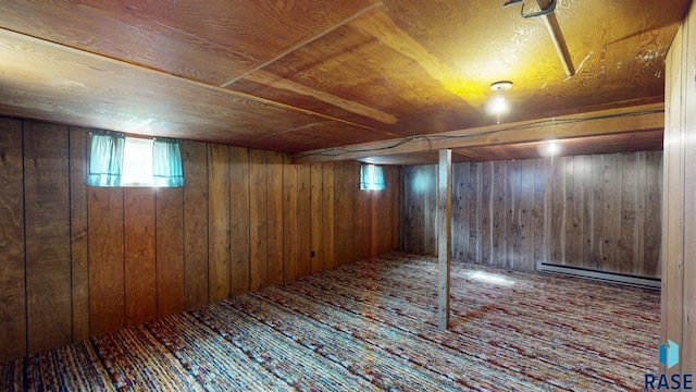 1024 Orchard Dr, Brookings, SD 57006 - basement featuring a baseboard radiator, wood walls, wood finished floors, and wood ceiling
