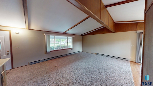 1024 Orchard Dr, Brookings, SD 57006 - spare room with a baseboard radiator, lofted ceiling, and light carpet