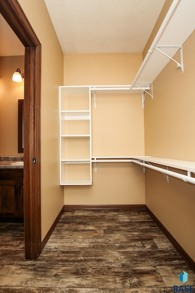 6400 S Keller Cir, Sioux Falls, SD 57108 - walk in closet with dark wood-style flooring