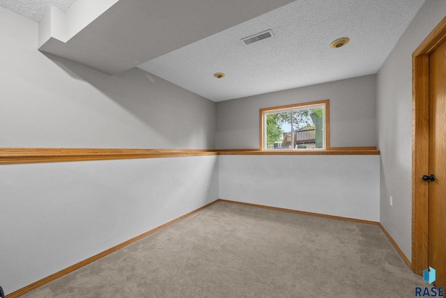 800 N Poplar Ave, Tea, SD 57064 - spare room with carpet, a textured ceiling, and baseboards
