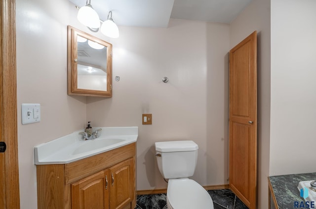 800 N Poplar Ave, Tea, SD 57064 - half bathroom featuring vanity, toilet, and baseboards