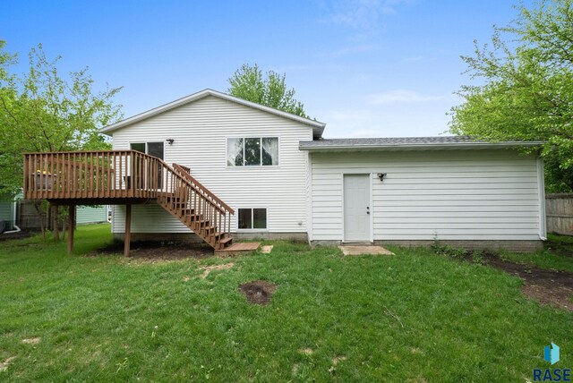 800 N Poplar Ave, Tea, SD 57064 - back of property with stairs, a wooden deck, a lawn, and roof with shingles
