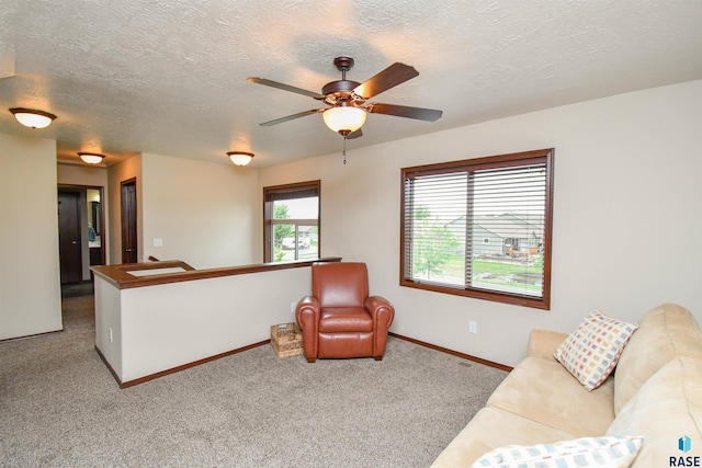 5411 S Ledgestone Pl, Sioux Falls, SD 57108 - carpeted living room with ceiling fan, baseboards, and a textured ceiling