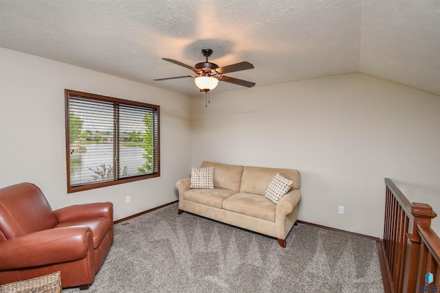 5411 S Ledgestone Pl, Sioux Falls, SD 57108 - carpeted living area with a ceiling fan, baseboards, vaulted ceiling, and a textured ceiling