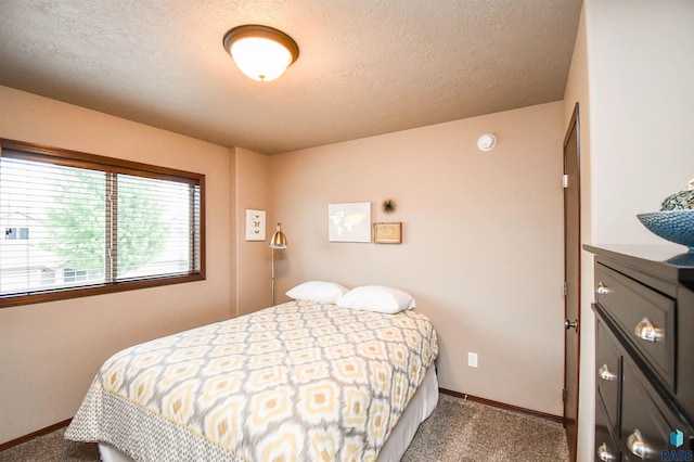 5411 S Ledgestone Pl, Sioux Falls, SD 57108 - carpeted bedroom with baseboards and a textured ceiling