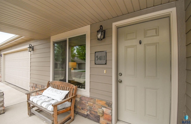 5411 S Ledgestone Pl, Sioux Falls, SD 57108 - view of exterior entry with a porch and stone siding