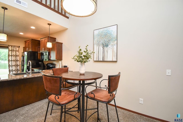 5411 S Ledgestone Pl, Sioux Falls, SD 57108 - carpeted dining room with a sink, baseboards, and recessed lighting