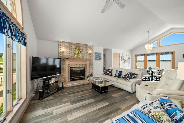 200 Best Point Dr, Madison, SD 57042 - living area featuring lofted ceiling, a chandelier, wood finished floors, a fireplace, and a water view