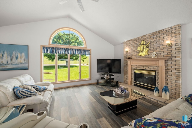 200 Best Point Dr, Madison, SD 57042 - living room featuring wood finished floors, a brick fireplace, a ceiling fan, and high vaulted ceiling
