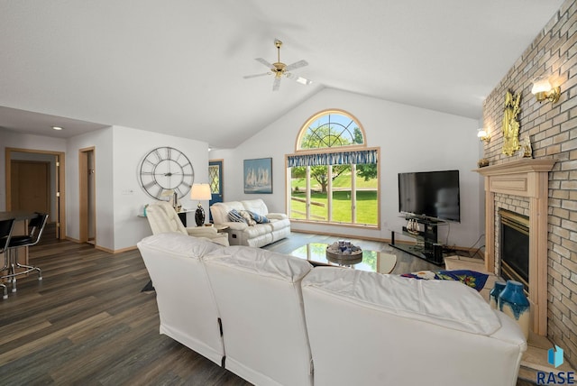 200 Best Point Dr, Madison, SD 57042 - living area with a ceiling fan, lofted ceiling, dark wood-style flooring, a brick fireplace, and baseboards