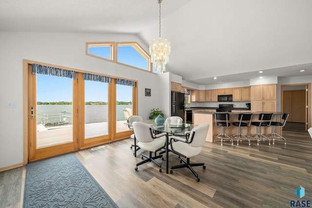 200 Best Point Dr, Madison, SD 57042 - dining area with high vaulted ceiling, recessed lighting, dark wood-type flooring, a chandelier, and a water view