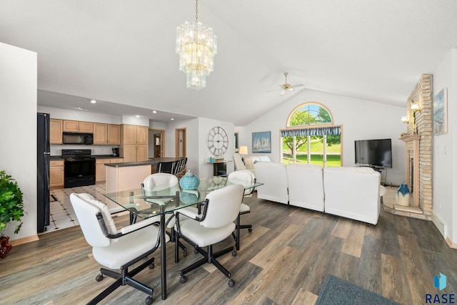 200 Best Point Dr, Madison, SD 57042 - dining space with vaulted ceiling, wood finished floors, a ceiling fan, a chandelier, and baseboards