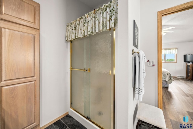 200 Best Point Dr, Madison, SD 57042 - bathroom featuring a shower stall, ensuite bathroom, and wood finished floors