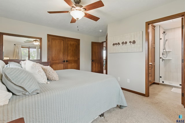 26646 461st Ave, Hartford, SD 57033 - bedroom featuring light colored carpet, baseboards, a ceiling fan, a closet, and ensuite bathroom