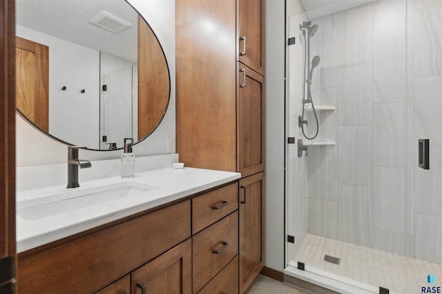 26646 461st Ave, Hartford, SD 57033 - full bathroom featuring vanity, a shower stall, and tile patterned flooring
