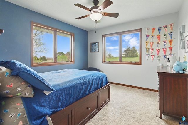 26646 461st Ave, Hartford, SD 57033 - carpeted bedroom featuring baseboards and a ceiling fan
