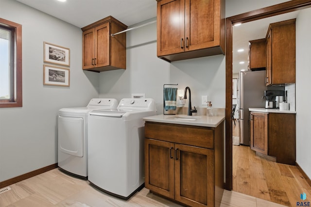 26646 461st Ave, Hartford, SD 57033 - laundry area featuring washer and clothes dryer, cabinet space, recessed lighting, and baseboards