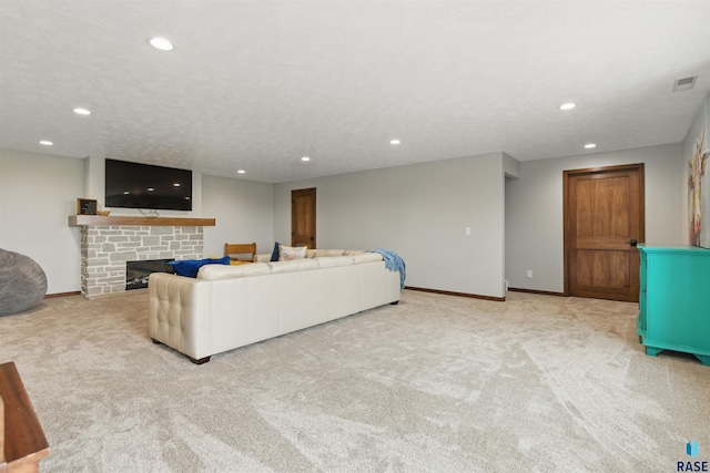 26646 461st Ave, Hartford, SD 57033 - living area featuring carpet floors, recessed lighting, baseboards, and a stone fireplace