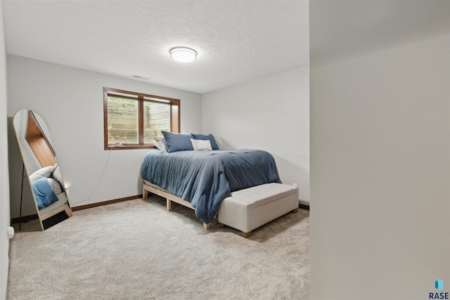 26646 461st Ave, Hartford, SD 57033 - carpeted bedroom with a textured ceiling and baseboards