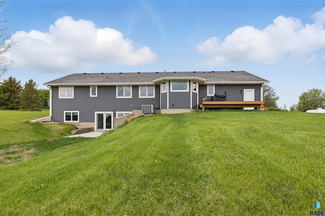 26646 461st Ave, Hartford, SD 57033 - rear view of house featuring central AC, a wooden deck, and a yard