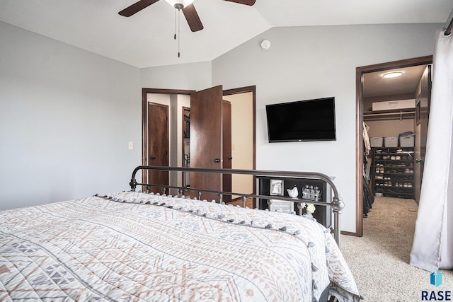 5300 W Sourwood Pl, Sioux Falls, SD 57107 - bedroom featuring carpet floors, a walk in closet, vaulted ceiling, a closet, and ceiling fan