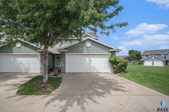 5300 W Sourwood Pl, Sioux Falls, SD 57107 - view of front of house with a front yard, driveway, and an attached garage
