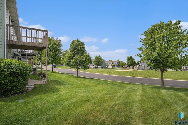 5300 W Sourwood Pl, Sioux Falls, SD 57107 - view of grassy yard with a deck and a residential view
