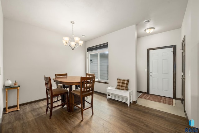 9054 W Ark Pl, Sioux Falls, SD 57106 - dining area featuring a chandelier, wood finished floors, and baseboards