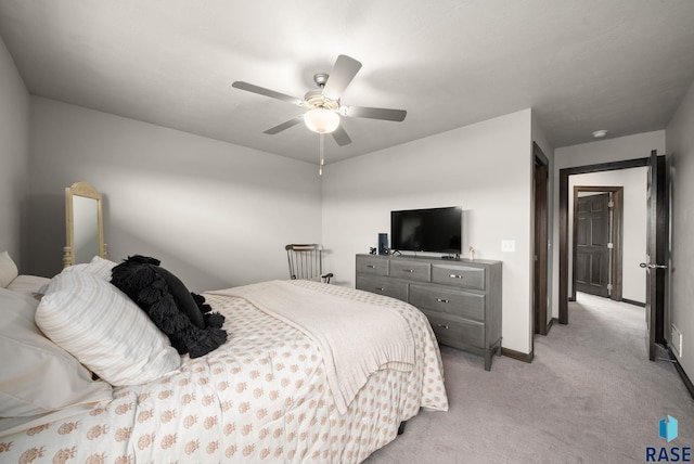 9054 W Ark Pl, Sioux Falls, SD 57106 - bedroom with light colored carpet, baseboards, and a ceiling fan