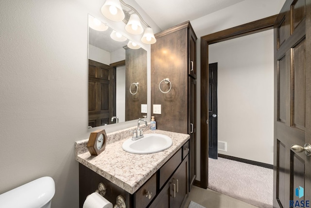 9054 W Ark Pl, Sioux Falls, SD 57106 - bathroom featuring vanity and toilet