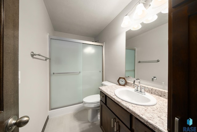 9054 W Ark Pl, Sioux Falls, SD 57106 - bathroom featuring vanity, a shower stall, toilet, and baseboards