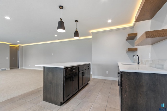 7324 E Twin Pines Ct, Sioux Falls, SD 57110 - kitchen featuring open shelves, a sink, light countertops, light tile patterned floors, and pendant lighting