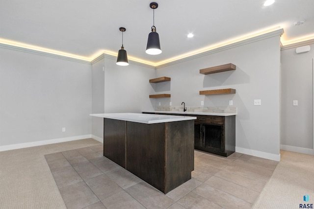 7324 E Twin Pines Ct, Sioux Falls, SD 57110 - kitchen featuring open shelves, light countertops, a kitchen island, decorative light fixtures, and baseboards